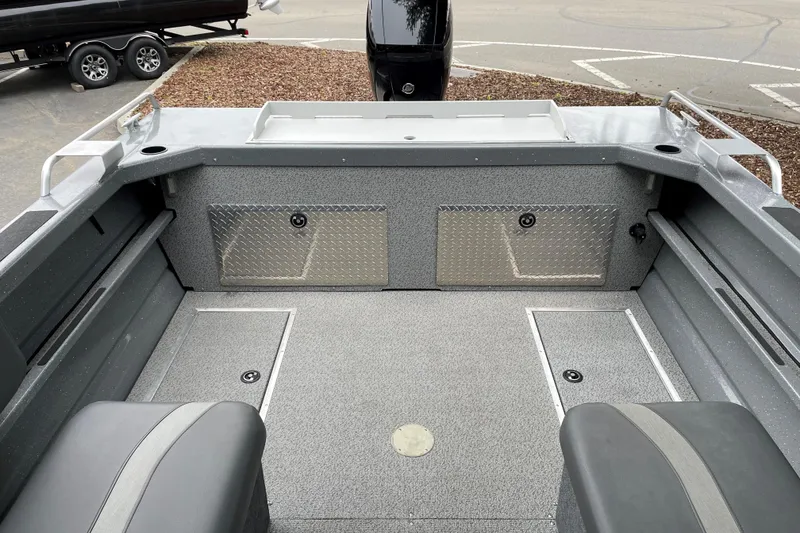 Slide: The Image of 2024 Spartan 185 Astoria boat interior with storage compartments and seating. - 12