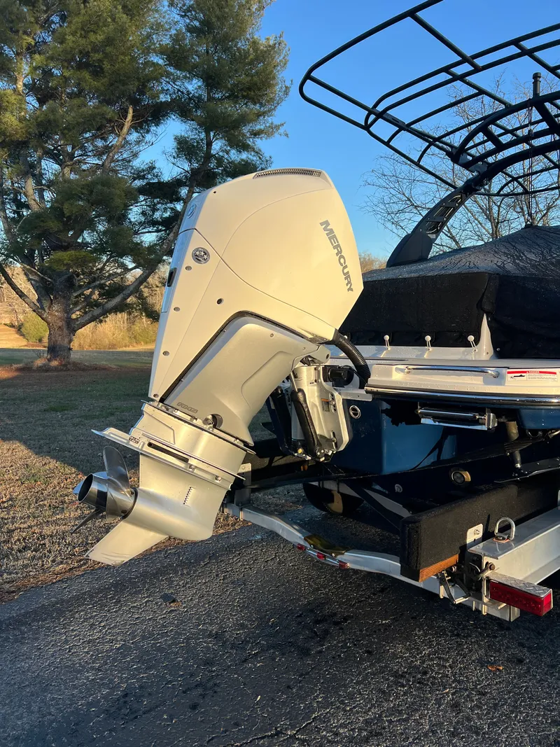 Slide: The Image of Interior of 2024 Sea Ray SLX 260 Outboard with GMC Denali in background. - 10