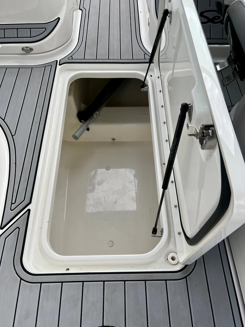 Slide: The Image of Storage compartment in 2024 Sea Ray SLX 260 Outboard boat. - 21