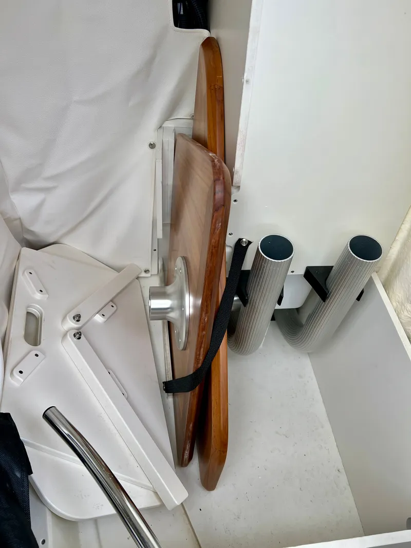 Slide: The Image of Interior of 2024 Sea Ray SLX 260 Outboard with table and mounts. - 25