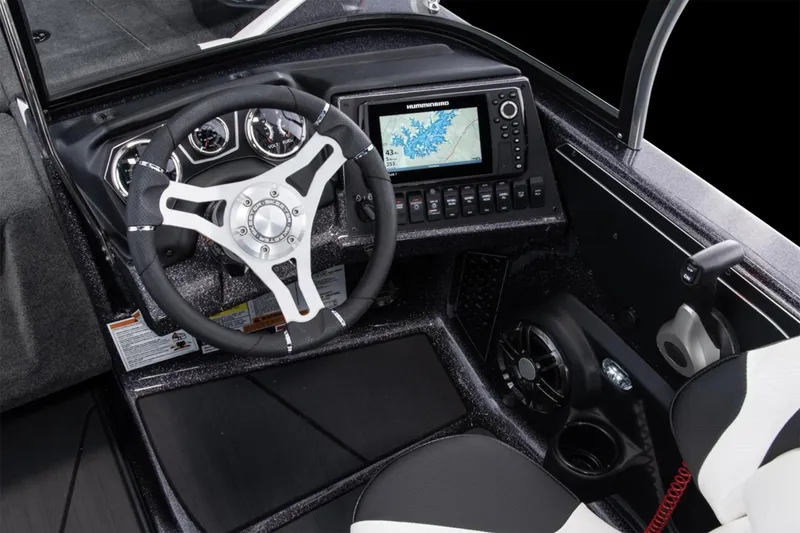 Slide: The Image of Manufacturer Provided Image: 2026 Skeeter Solera 205 boat dashboard with steering wheel and navigation system. - 12