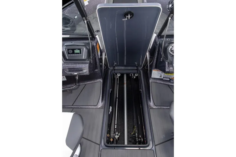 Slide: The Image of Manufacturer Provided Image: 2026 Skeeter Solera 205 boat interior with open storage compartment for fishing rods. - 17