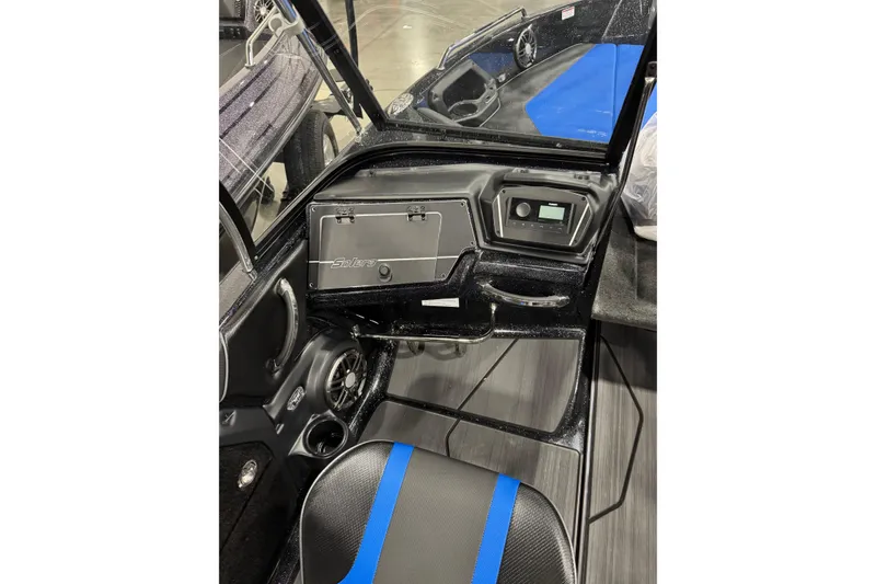 Slide: The Image of 2026 Skeeter Solera 205 boat interior with sleek dashboard and blue-accented seating. - 4