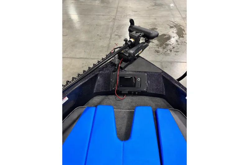 Slide: The Image of 2026 Skeeter Solera 205 boat interior with blue seating and navigation equipment. - 6