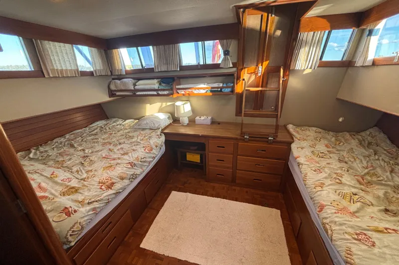 Slide: The Image of Cozy cabin interior of 1989 Grand Banks 46 Classic yacht with twin beds and wooden furnishings. - 101