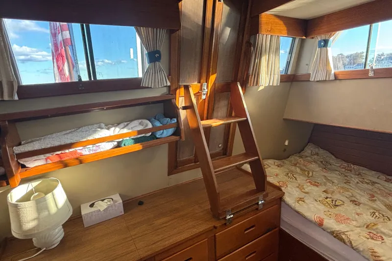 Slide: The Image of Cozy cabin interior of 1989 Grand Banks 46 Classic yacht with wooden furnishings. - 104