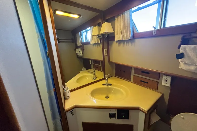 Slide: The Image of Bathroom interior of 1989 Grand Banks 46 Classic yacht with sink and mirror. - 107
