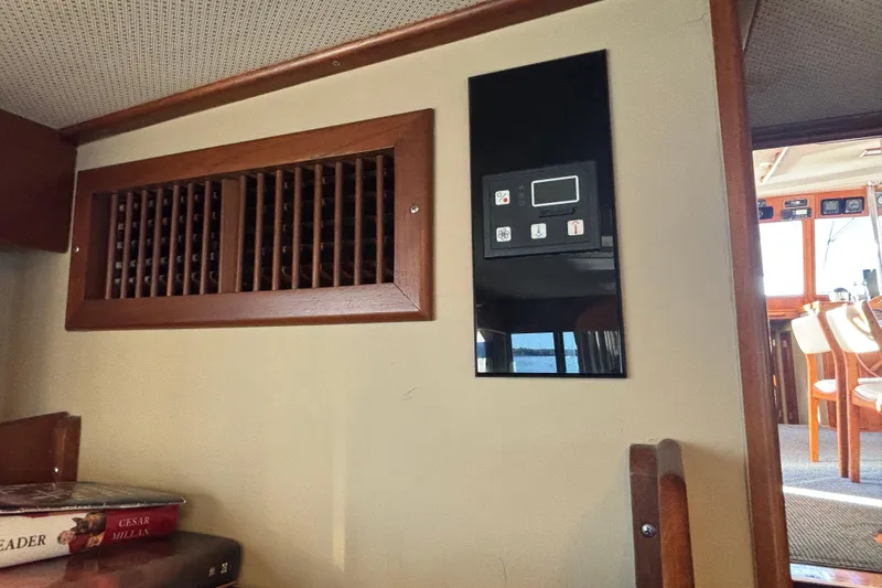 Slide: The Image of Interior of 1989 Grand Banks 46 Classic yacht with wooden vent and control panel. - 113