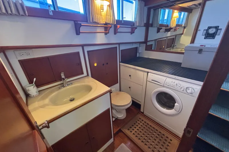 Slide: The Image of Laundry area with sink and washing machine on 1989 Grand Banks 46 Classic yacht. - 121