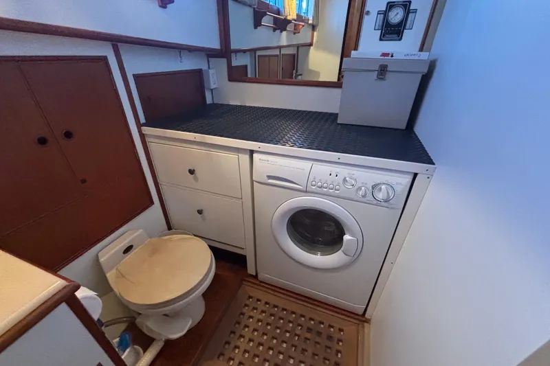 Slide: The Image of Laundry area with washer and toilet on 1989 Grand Banks 46 Classic yacht. - 122