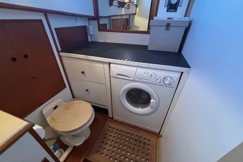 Slide: The Image of Laundry area with washer and toilet on 1989 Grand Banks 46 Classic yacht. - 123