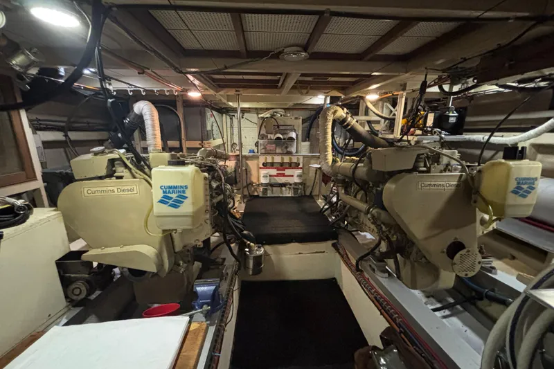 Slide: The Image of Engine room of 1989 Grand Banks 46 Classic with Cummins Diesel engines. - 133
