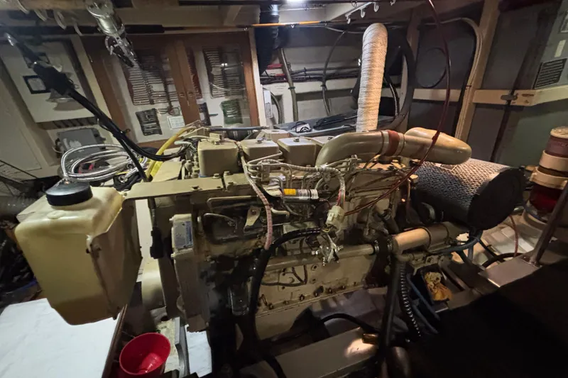 Slide: The Image of Engine room of a 1989 Grand Banks 46 Classic yacht, showcasing detailed machinery. - 134