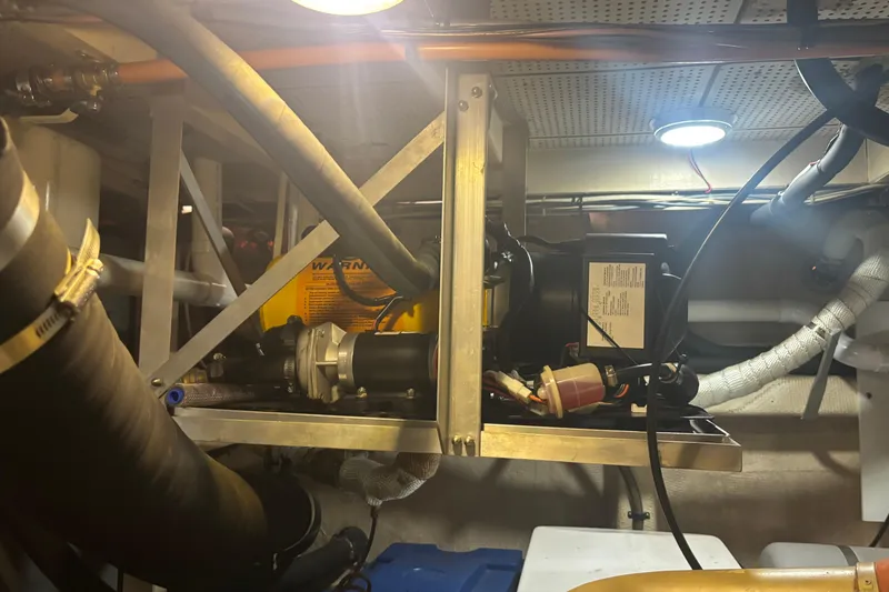 Slide: The Image of Engine room of 1989 Grand Banks 46 Classic yacht with mechanical components. - 138