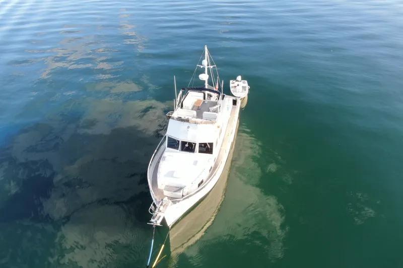 Slide: The Image of 1989 Grand Banks 46 Classic yacht on calm water, aerial view. - 3
