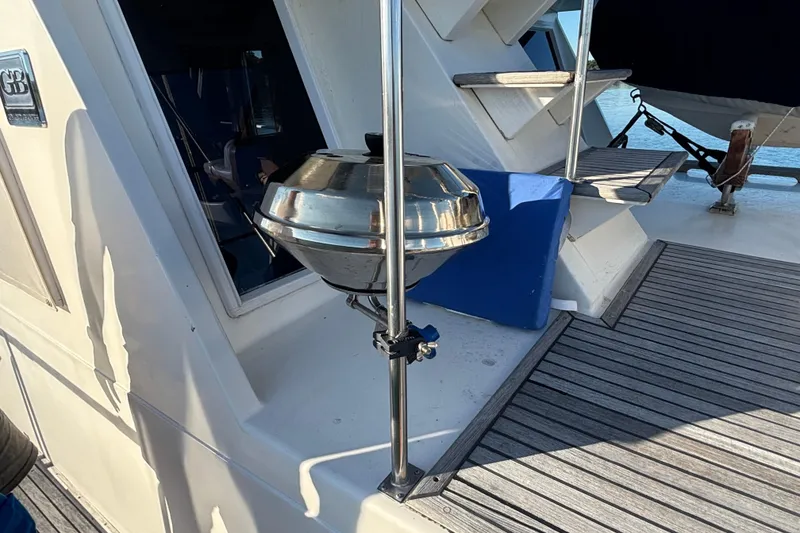 Slide: The Image of 1989 Grand Banks 46 Classic yacht deck with stainless steel grill and wooden flooring. - 41