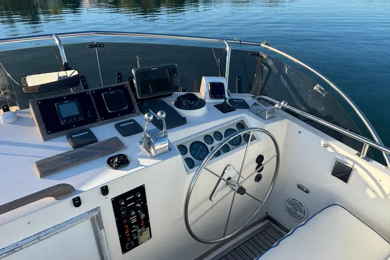 Slide: The Image of Cockpit of 1989 Grand Banks 46 Classic yacht with navigation instruments and steering wheel. - 51