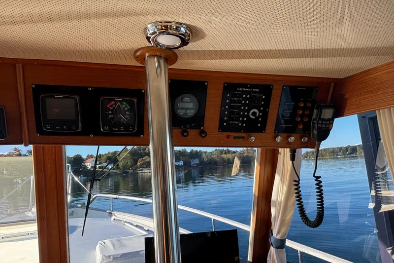 Slide: The Image of Interior view of 1989 Grand Banks 46 Classic yacht with control panel and scenic waterway. - 68
