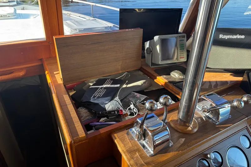 Slide: The Image of Helm of 1989 Grand Banks 46 Classic with navigation equipment and controls. - 74