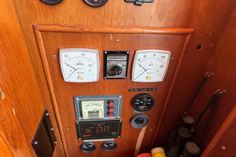 Slide: The Image of Control panel of a 1989 Grand Banks 46 Classic boat with gauges and switches. - 78
