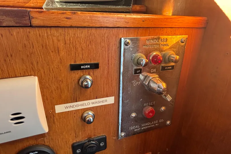 Slide: The Image of Control panel of 1989 Grand Banks 46 Classic boat with horn and windlass switches. - 79