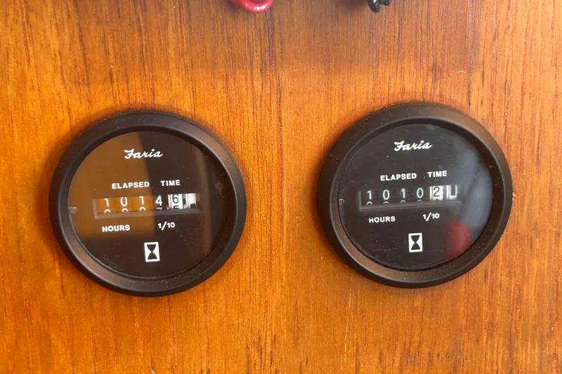 Slide: The Image of Faria elapsed time gauges on 1989 Grand Banks 46 Classic boat dashboard. - 80