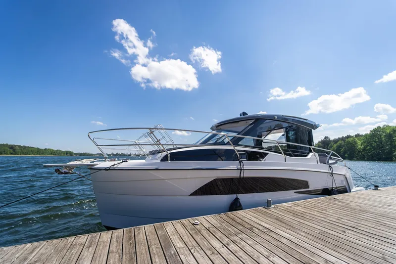 Slide: The Image of Luxury Nautic 880 yacht with champagne, flowers, and fruit on deck, 2025 model. - 6