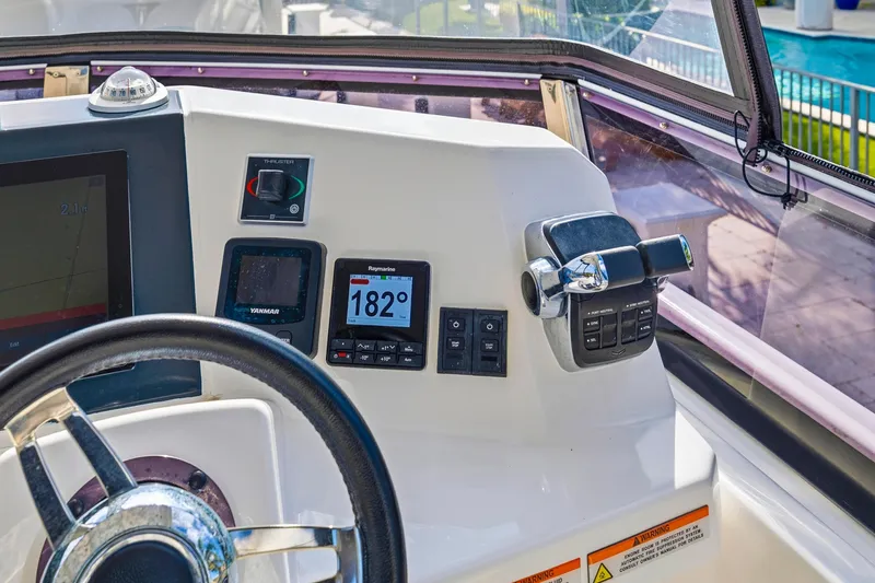 Slide: The Image of Helm of 2023 Leopard 46 Powercat with navigation instruments and controls. - 26