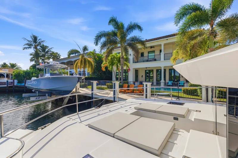 Slide: The Image of Luxurious Leopard 46 Powercat yacht docked near a waterfront villa, 2023 model. - 28