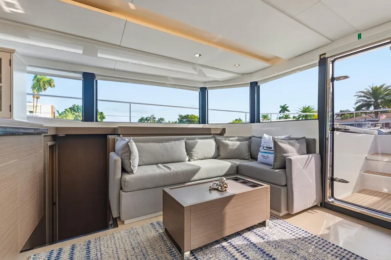 Slide: The Image of Luxurious interior of 2023 Leopard 46 Powercat yacht with modern sofa and panoramic windows. - 44