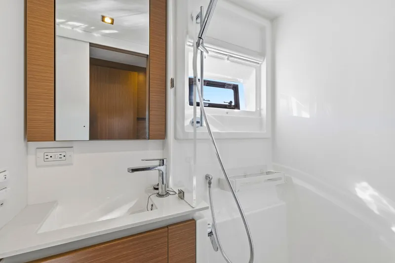 Slide: The Image of Modern bathroom in 2023 Leopard 46 Powercat yacht with sleek fixtures and window. - 56