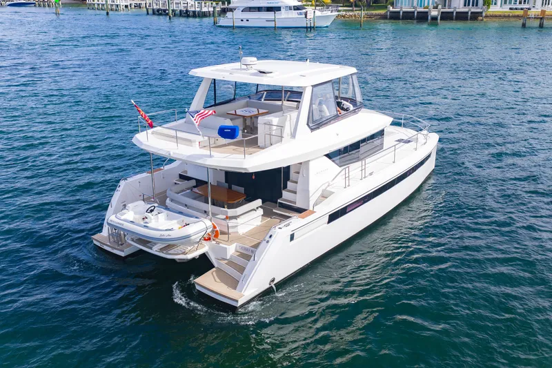 Slide: The Image of 2023 Leopard 46 Powercat yacht cruising on blue water, showcasing modern design and luxury. - 6