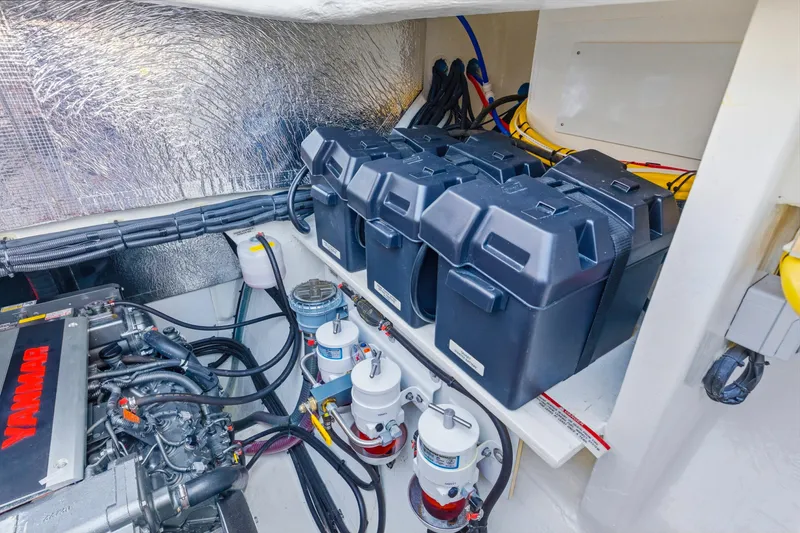 Slide: The Image of Engine room of 2023 Leopard 46 Powercat with Yanmar engine and battery setup. - 67