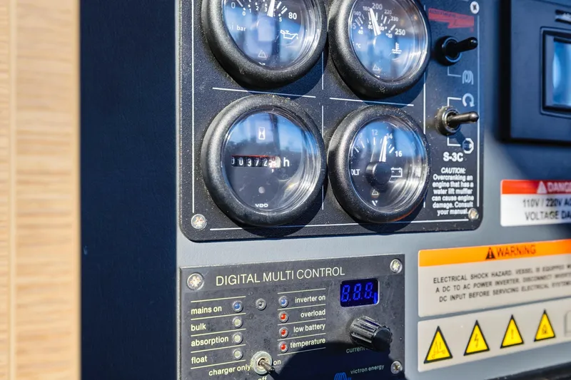 Slide: The Image of Control panel of 2023 Leopard 46 Powercat with gauges and digital multi-control display. - 68