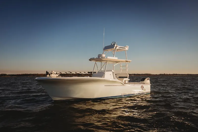 The Image of 2026 Composite Yacht 26CC on calm water at sunset. - 1