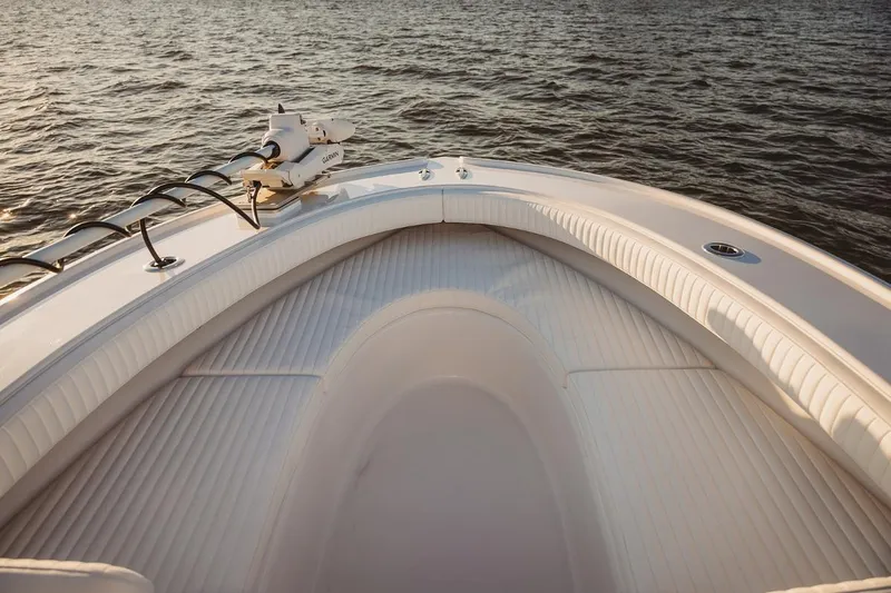 Slide: The Image of Bow of 2026 Composite Yacht 26CC on calm water, featuring sleek design and modern equipment. - 4