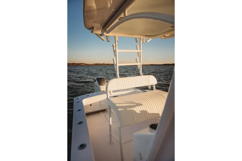 Slide: The Image of 2026 Composite Yacht 26CC on water, showcasing sleek design and comfortable seating. - 7