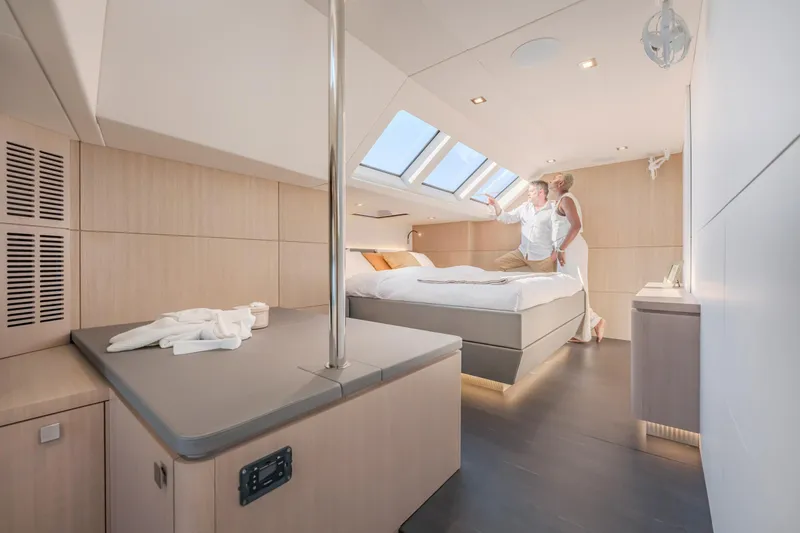 Slide: The Image of Luxurious cabin interior of 2025 Privilege Signature 650 yacht with modern design and skylight. - 22