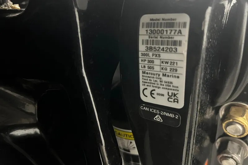 Slide: The Image of Label on 2024 Action 23 Open boat engine, displaying model and serial numbers. - 4