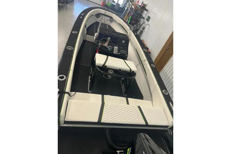 Slide: The Image of 2024 Action 23 Open boat interior with white seating and modern dashboard. - 5