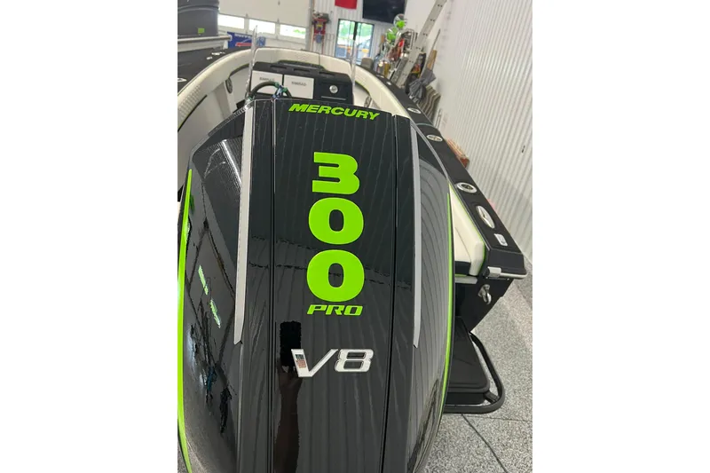 Slide: The Image of 2024 Action 23 Open boat with Mercury 300 Pro V8 engine in showroom. - 8