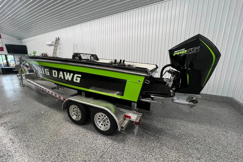 Slide: The Image of 2024 Action 23 Open boat with Mercury Pro XS engine in a showroom. - 9