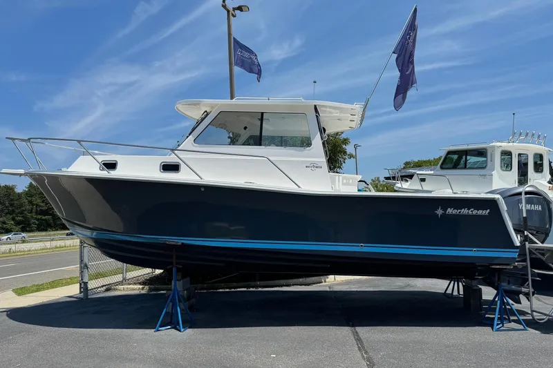 The Image of 2024 NorthCoast 285 HT boat on a parking lot. - 0