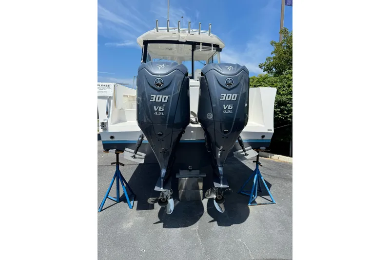 Slide: The Image of 2024 NorthCoast 285 HT with twin Yamaha 300 V6 outboard engines. - 2