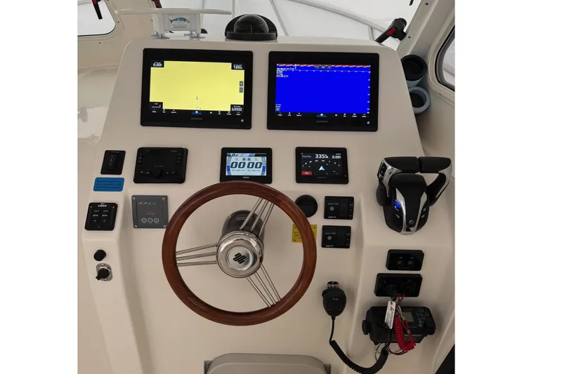 Slide: The Image of Interior view of 2024 NorthCoast 285 HT boat cockpit. - 3