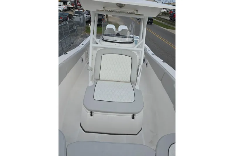 Slide: The Image of 2023 Sea Fox 288 Commander boat interior with cushioned seating and helm station. - 16