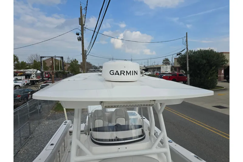 Slide: The Image of 2023 Sea Fox 288 Commander boat with Garmin radar, parked on a street. - 17