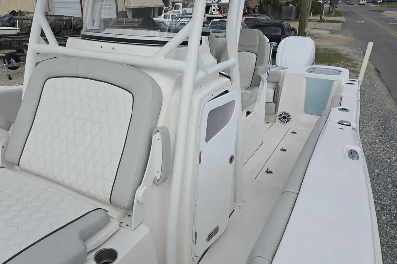 Slide: The Image of 2023 Sea Fox 288 Commander boat interior with white seating and storage compartments. - 19
