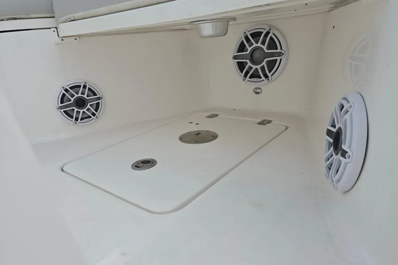 Slide: The Image of 2023 Sea Fox 288 Commander boat interior with speakers and storage compartment. - 22