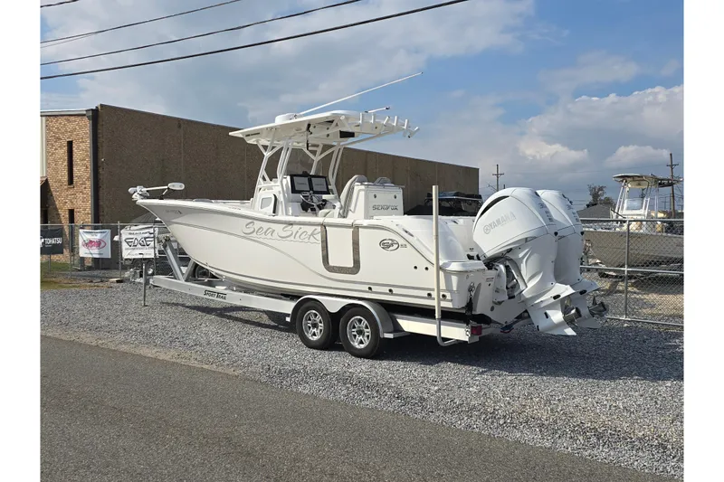 Slide: The Image of 2023 Sea Fox 288 Commander boat on trailer, parked outdoors. - 4